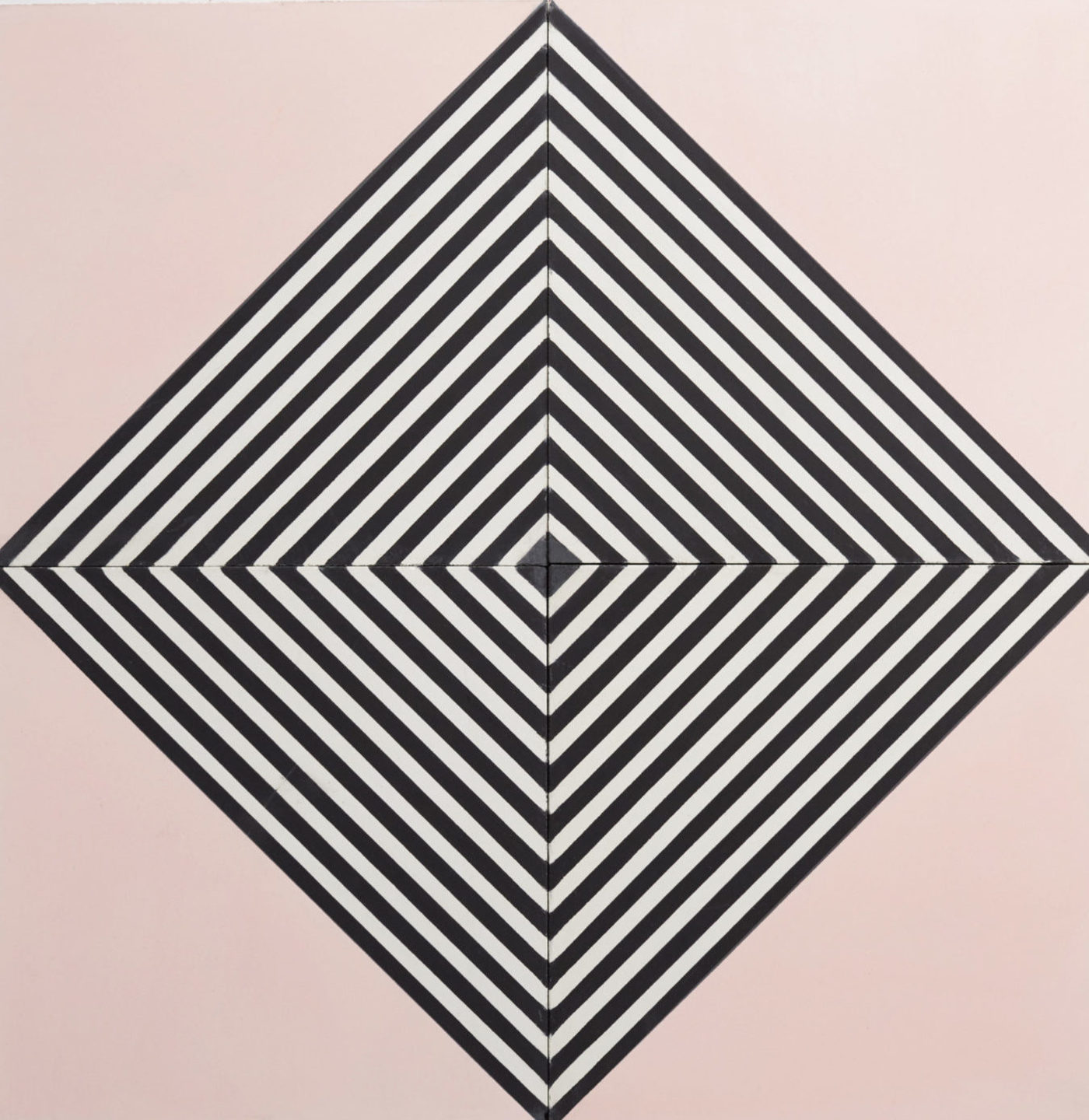 four pink tiles forming a black and white diamond pattern.