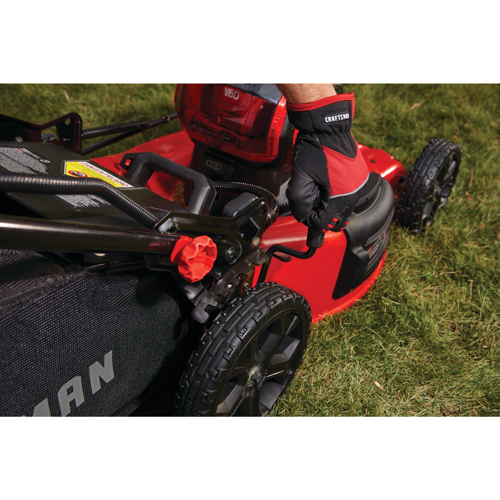 Single lever height adjustment feature of cordless 21 inch 3 in 1 lawn mower kit 5 amp hour.
