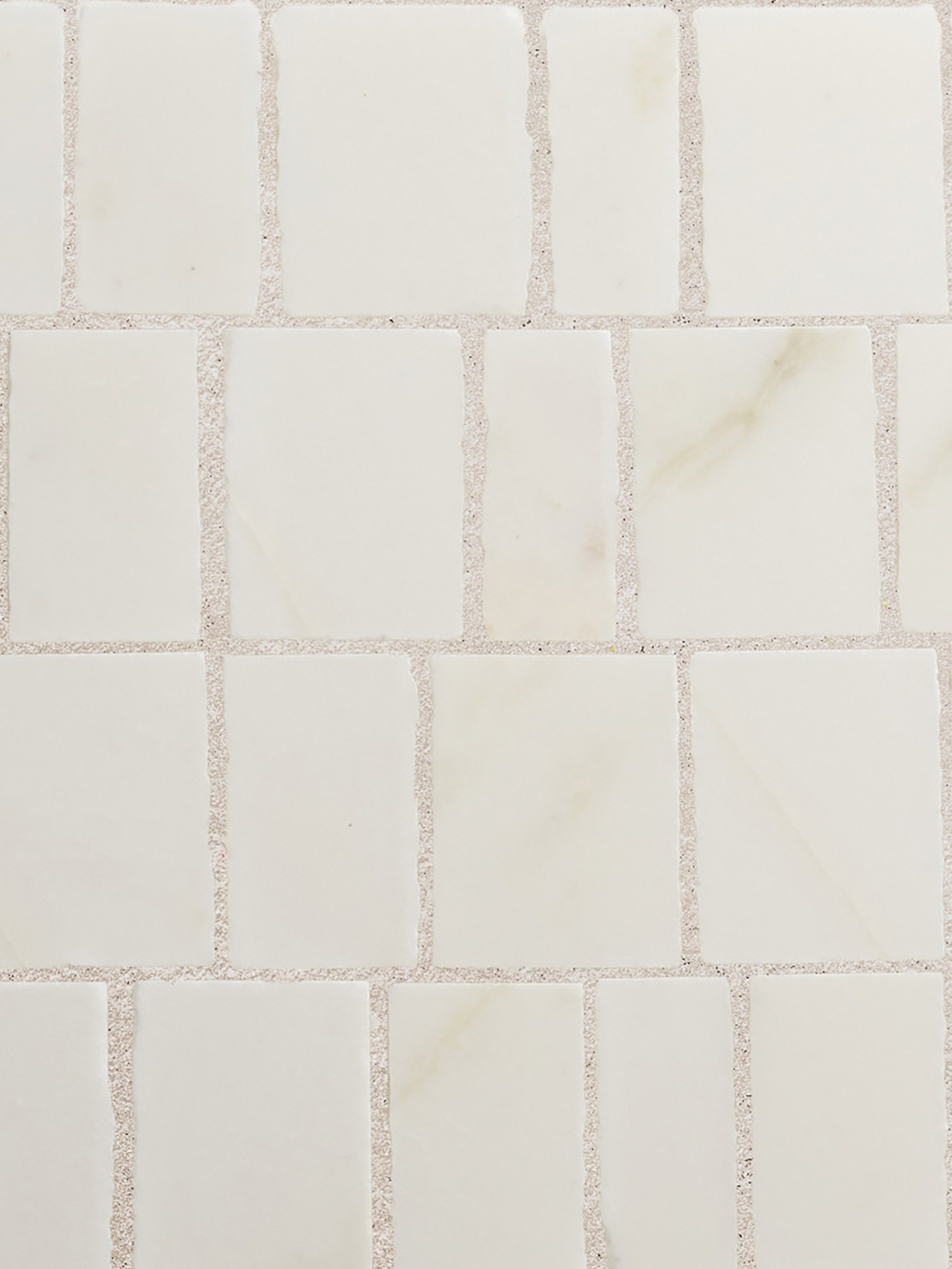 a close up image of a white marble tile.