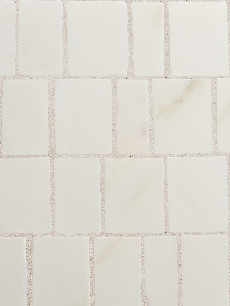 a close up image of a white marble tile.