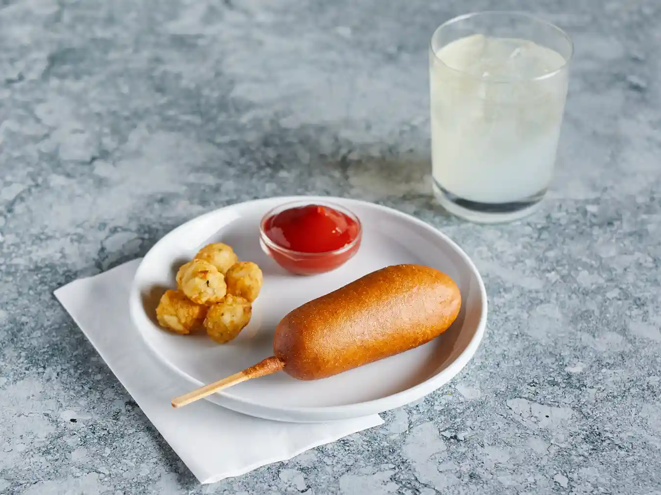 Tyson® Whole Grain Battered Chicken Corn Dogs, 4 oz. https://images.salsify.com/image/upload/s--Qi-KcyGe--/q_25/fc319de881f36bcc9837bfe45bc31e606ef0eb97.webp