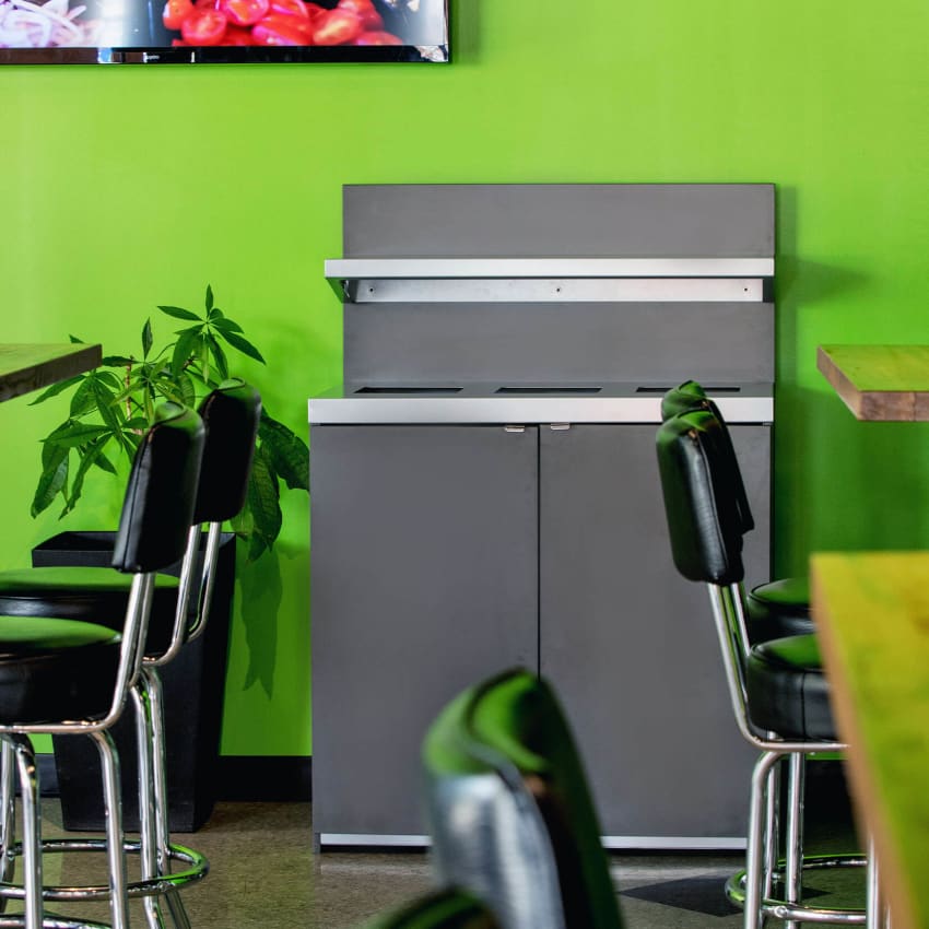 indoor waste and recycling collection station for restaurants made from melamine and powder coated steel in a lunch cafe