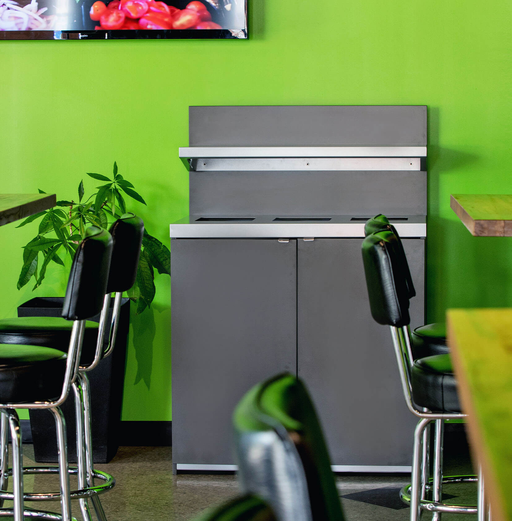 indoor waste and recycling collection station for restaurants made from melamine and powder coated steel in a lunch cafe