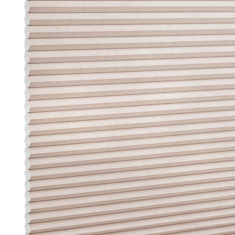 Beige honeycomb cellular blind with horizontal pleats and textured fabric, fully lowered and closed, diffusing light across a neutral, softly lit interior close-up.