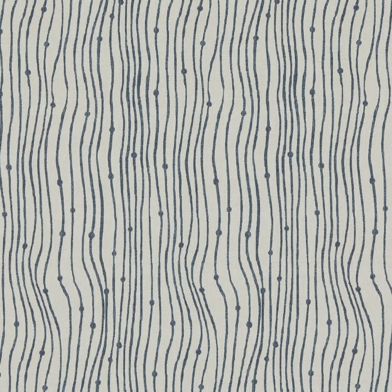 Textile swatch of cream fabric patterned with narrow navy embroidered wavy vertical lines punctuated by small knots; repeating lines undulate across the surface; close-up, evenly lit, neutral background.