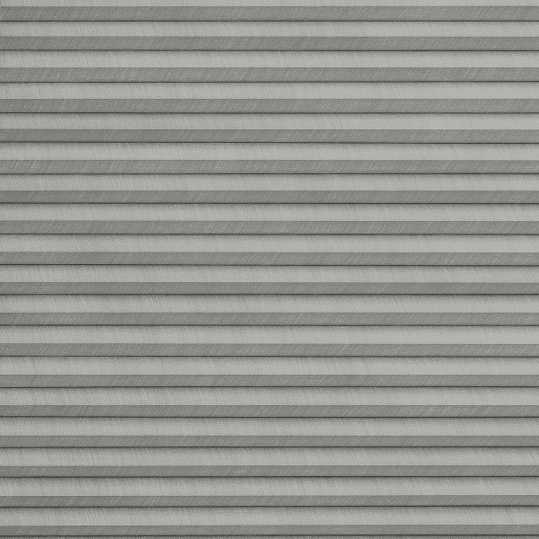 Grey pleated cellular blinds across the frame, closed with uniform horizontal folds and textured fabric; blocking view and softly diffusing light in a neutral, minimally lit interior.