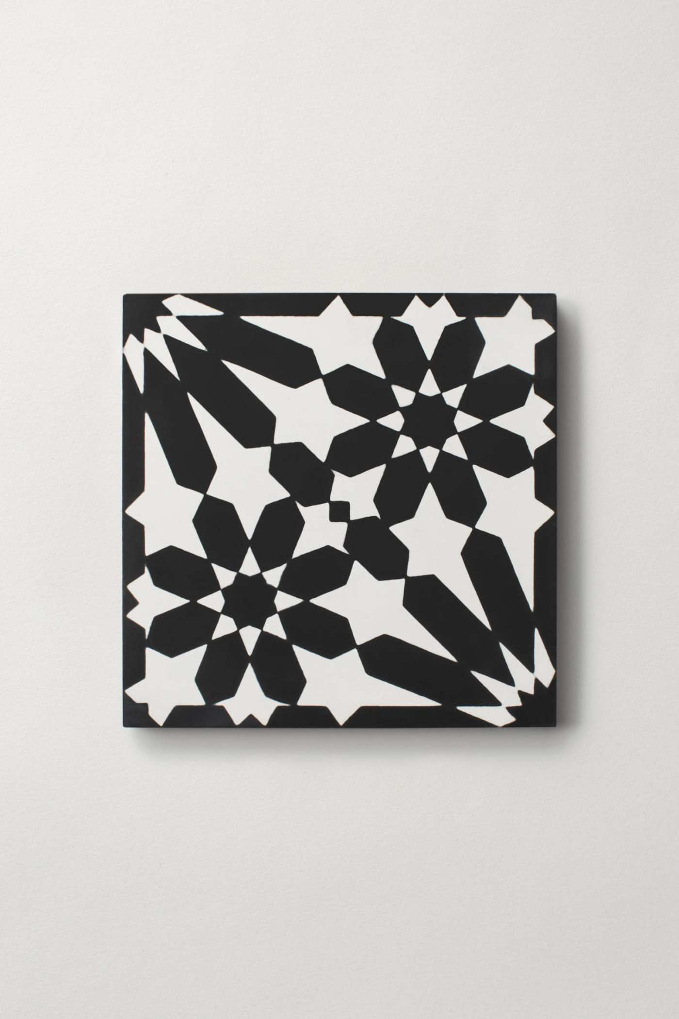 a black and white design on a white surface.