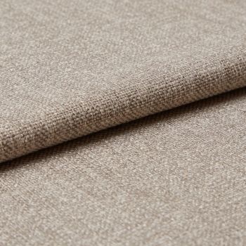 Beige woven upholstery fabric (tight basket weave), folded over an edge, displaying textured threads and slight sheen; close-up on a flat surface under soft, diffused lighting.