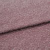 Burgundy fabric patterned with dense, irregular white dots, folded across the center; lying flat in a close-up studio shot, even lighting highlights its texture and subtle sheen.