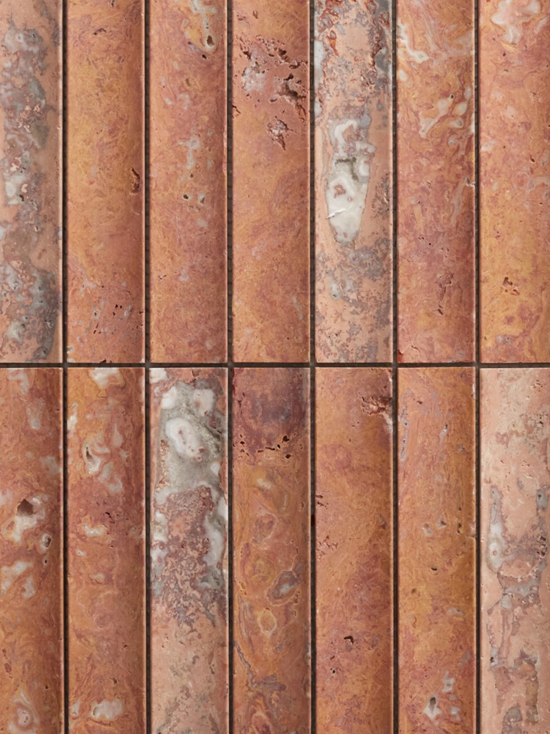 a close up image of a red tiled wall.