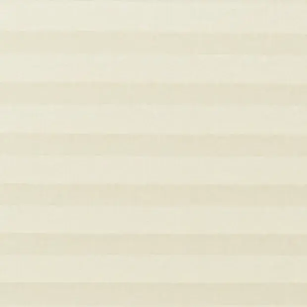 Cream pleated cellular blind covering a window, fully lowered and closed with soft horizontal bands; gently diffusing daylight into a neutral, evenly lit interior.