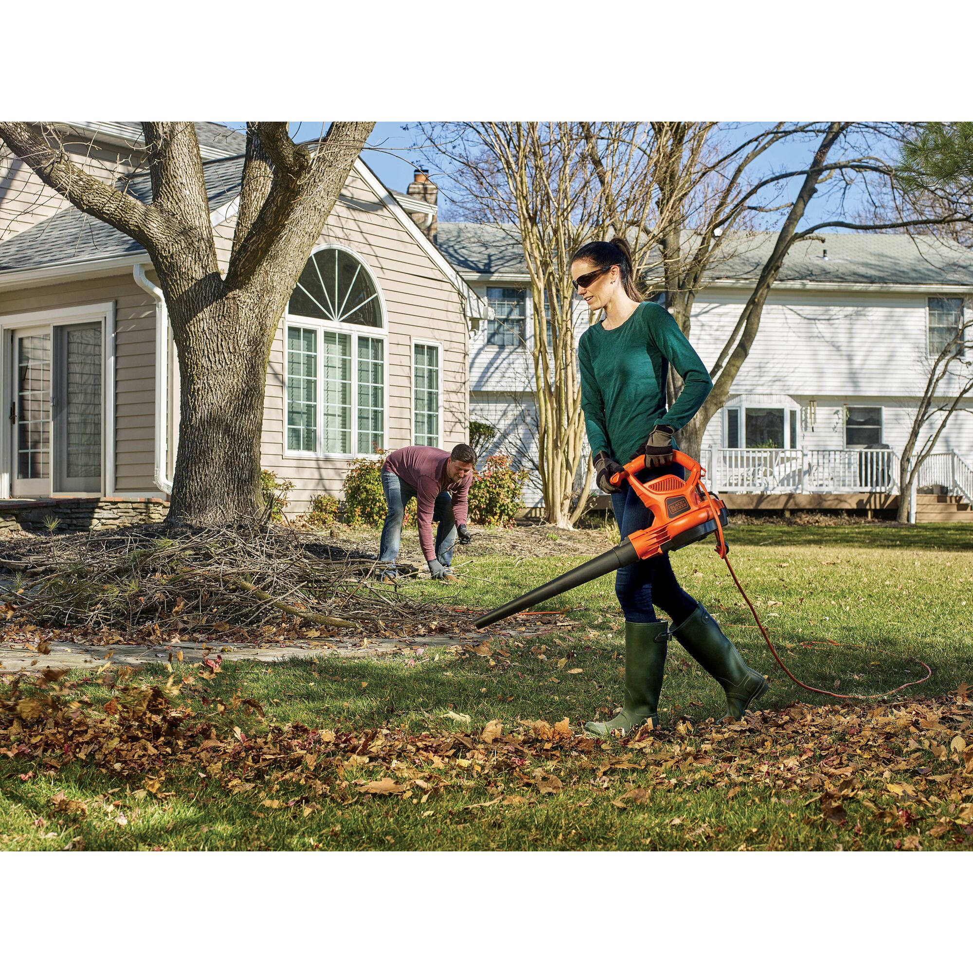 3 in 1 VACPACK 12 Ampere leaf blower, vacuum, and mulcher being used by a person outdoors.