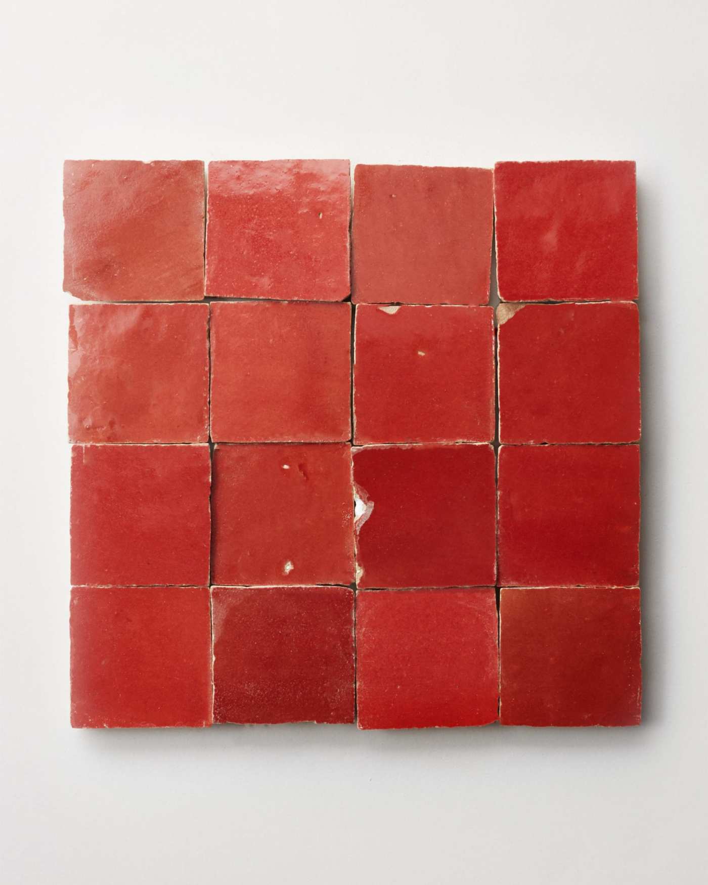 red tiles on a white surface.