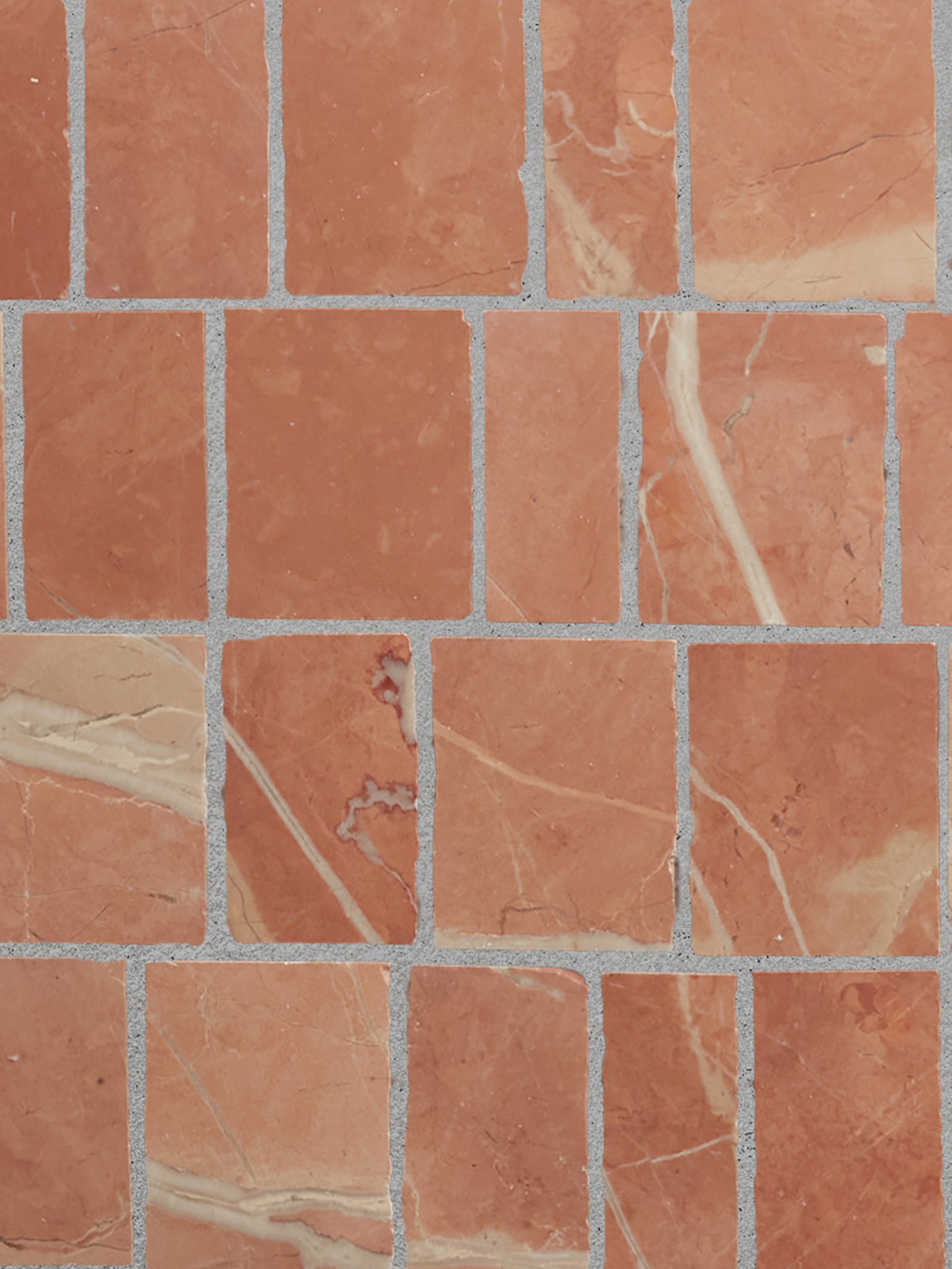 a close up image of a red mosaic tiled surface.