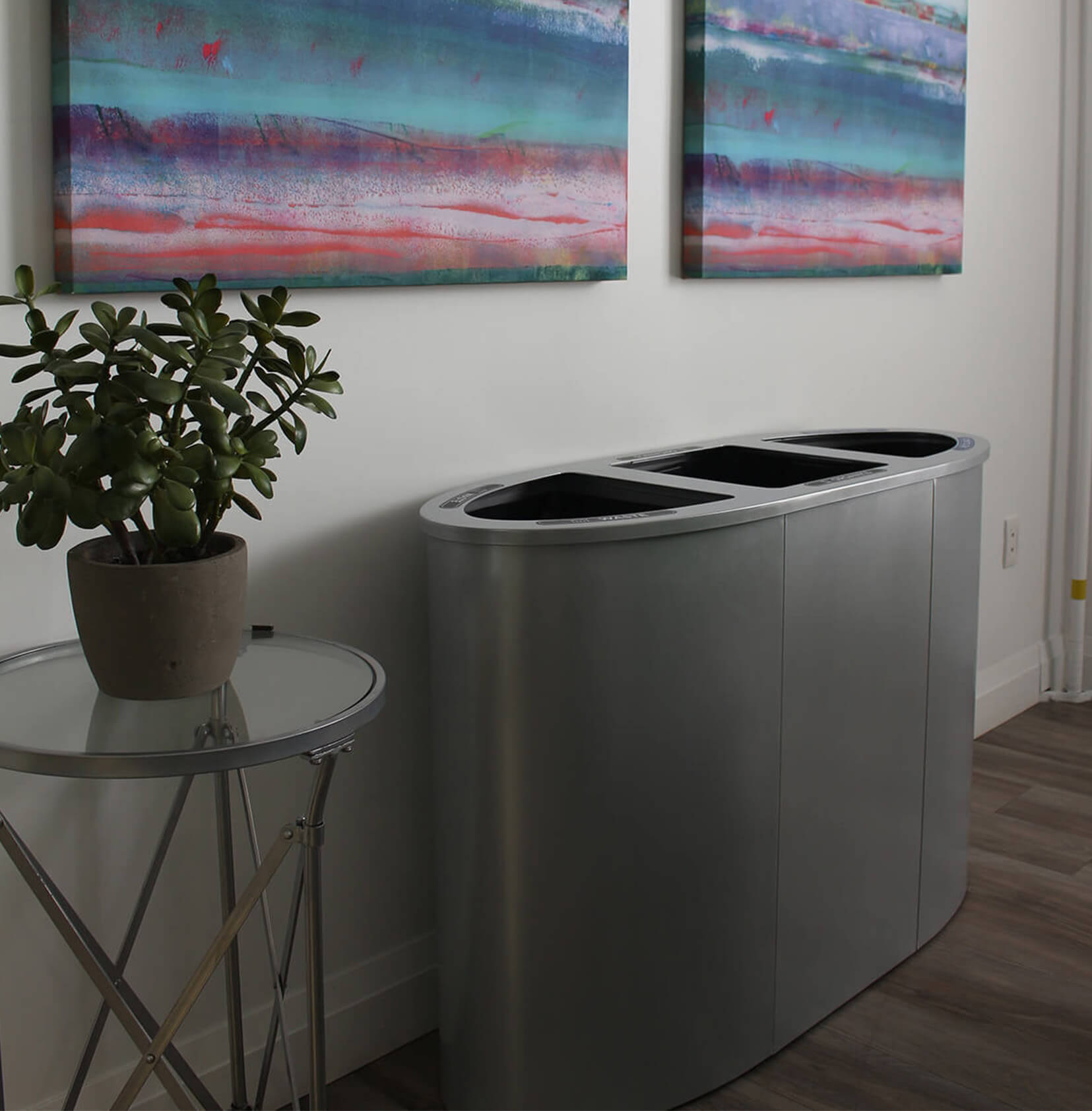 triple opening trash and recyclables station with silver powder coated steel body in an upscale office