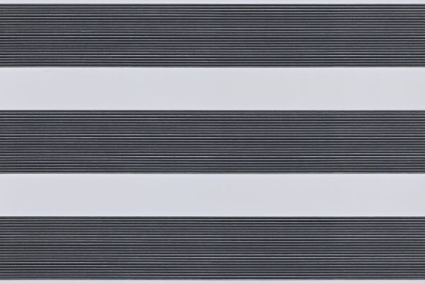 Dual-layer horizontal zebra roller blind mounted across the frame, aligned into alternating wide opaque white bands and narrow ribbed dark-gray slats, partially filtering light; interior close-up with soft even lighting.