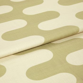 Fabric with large oliveâ€‘green rounded geometric motifs, folded and layered, showing woven texture and seams; studioâ€‘lit close-up of a neutralâ€‘colored textile sample.