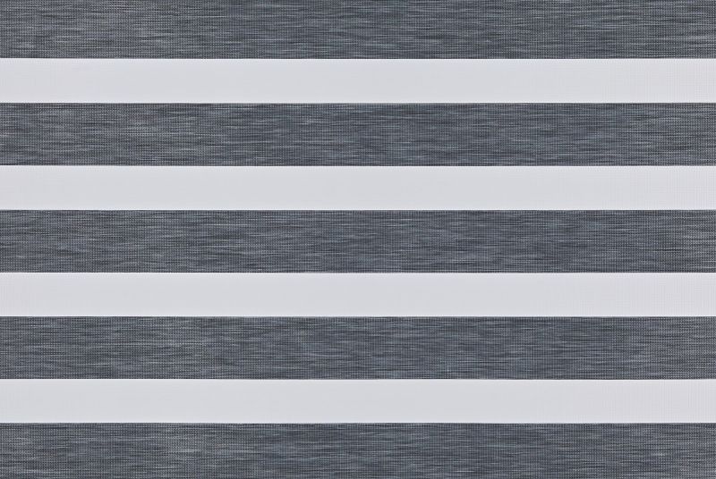 Zebra-style roller blind with alternating opaque white and semi-transparent dark-gray textured horizontal bands; bands aligned to create alternating blocked and filtered light; covers a window in a neutral, evenly lit interior.