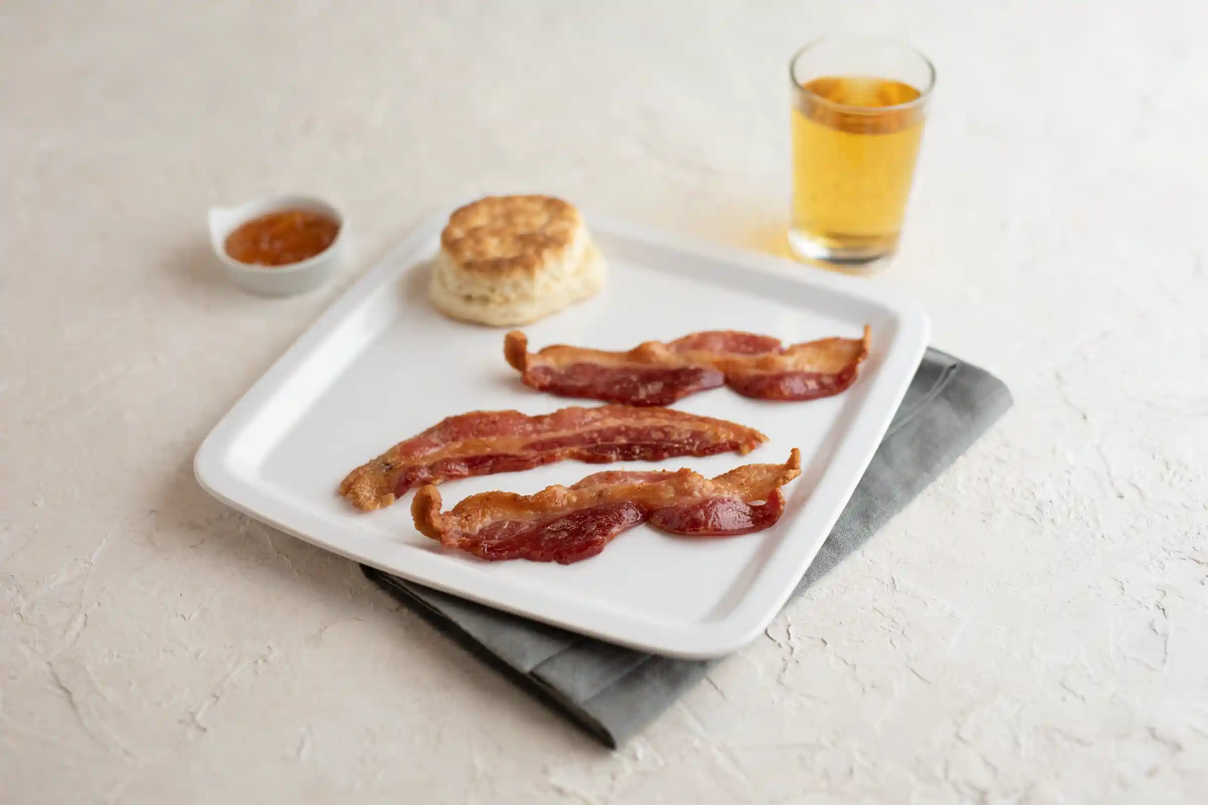 Wright® Brand Naturally Applewood Smoked Thick Sliced Bacon, Flat-Pack®,  15 Lbs, 10-14 Slices per Pound, Frozen https://images.salsify.com/image/upload/s--bSpINDj7--/q_25/ixldpw0gigzoquppwmjo.webp