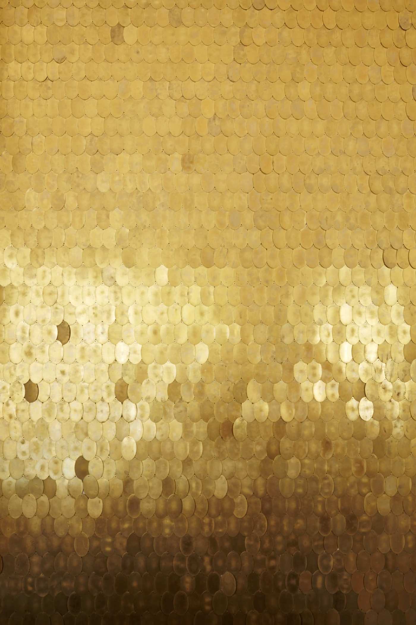 a gold mosaic background with a lot of circles.