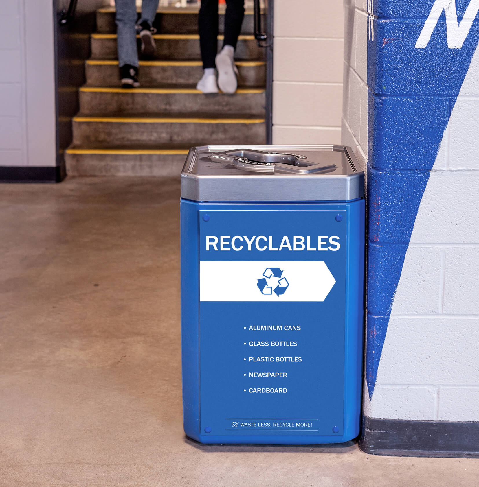 large capacity recyclables container in a sports stadium with a mixed opening restrictive lid