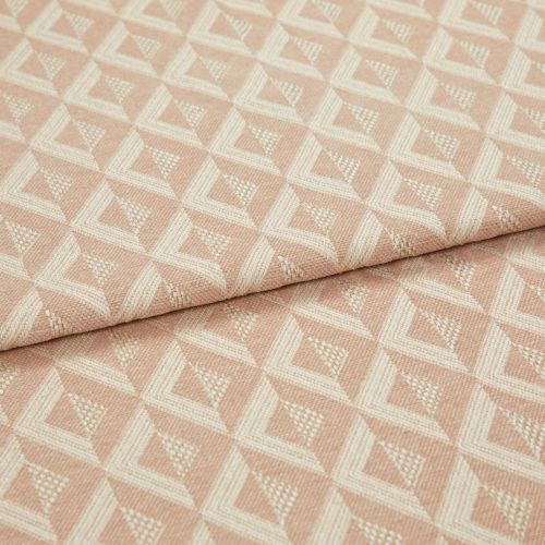 Woven pink geometric jacquard fabric, folded over itself, displaying raised cream triangular diamond pattern; close-up on a flat surface with soft, even studio lighting emphasizing texture.