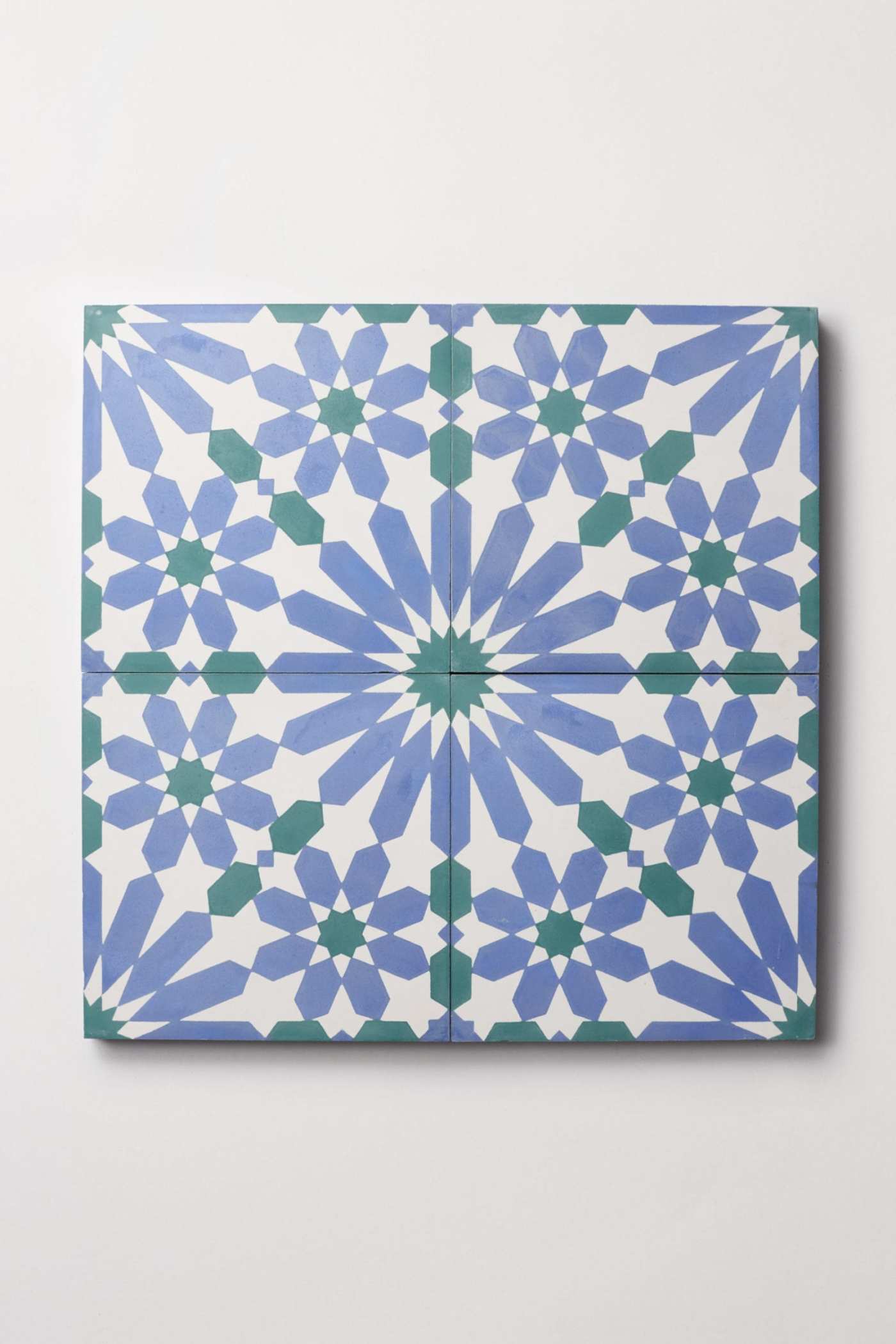 a blue and white tile on a white background.