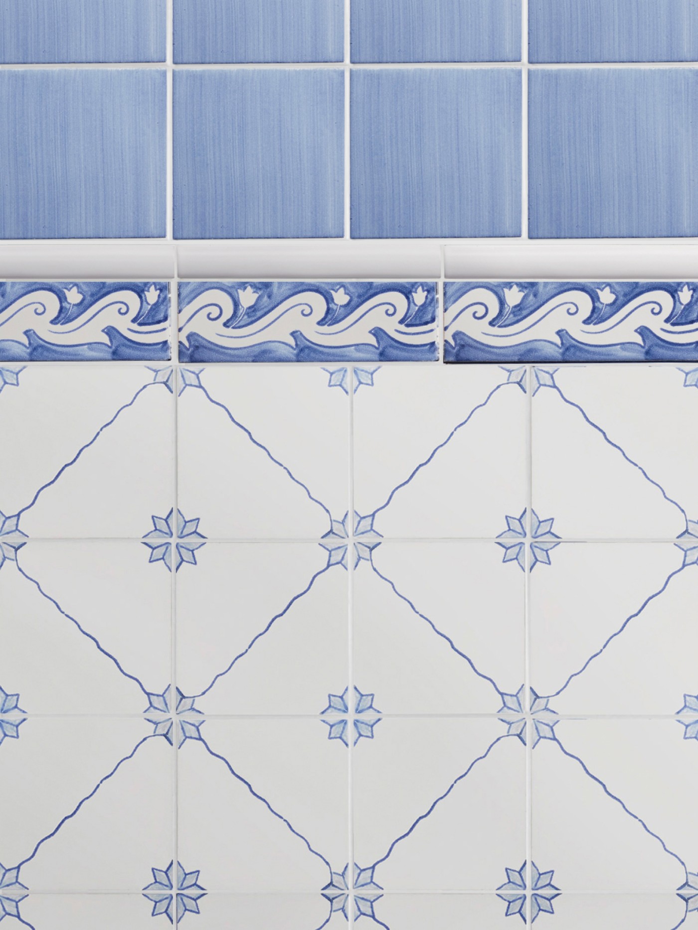 blue and white tiles with a designs on them.