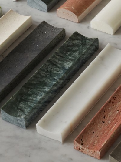 a row of different colored marble slabs on a marble table.