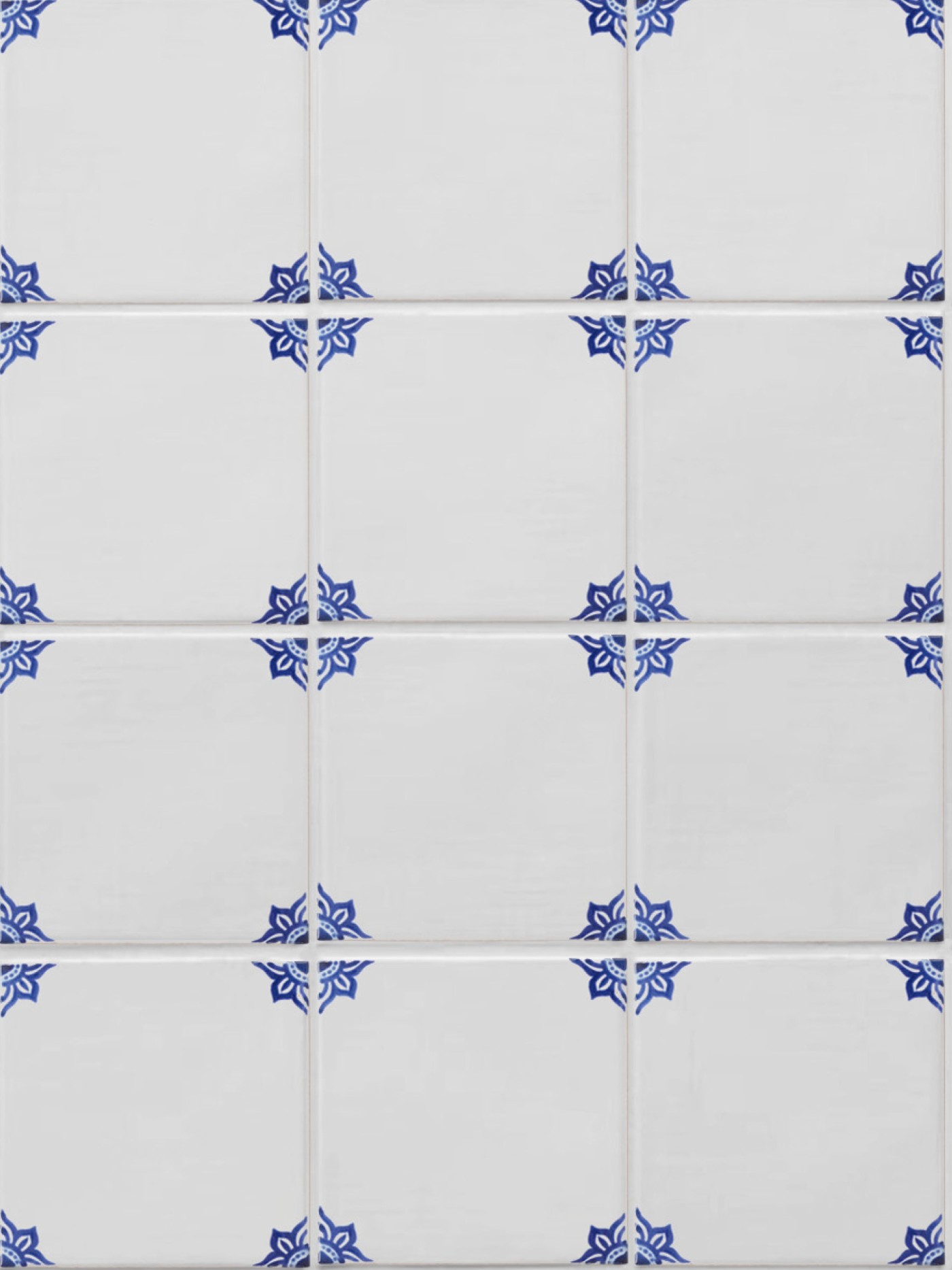white tiles with hand painted blue designs.