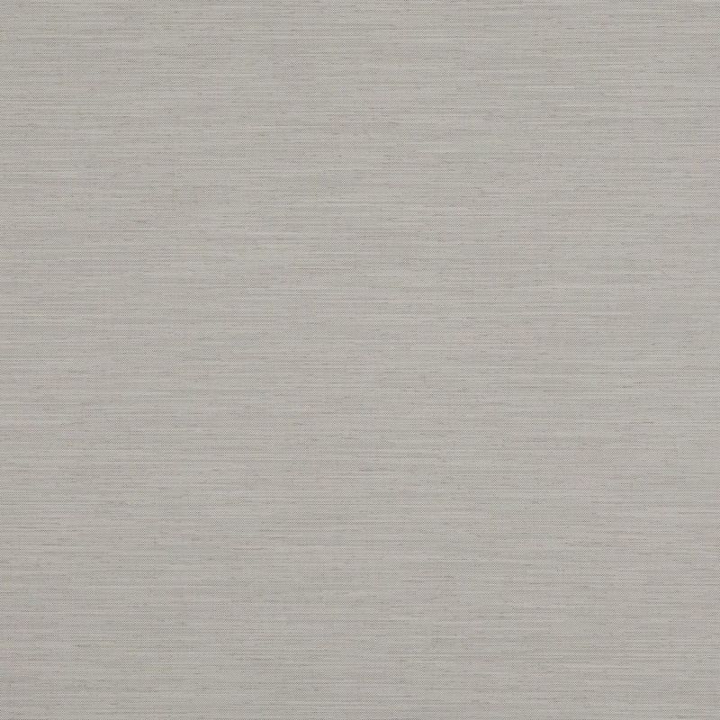 A light grey-beige woven roller blind, fully lowered and opaque, filtering soft daylight; neutral textured fabric fills the frame, suggesting a closed window in a softly lit interior.