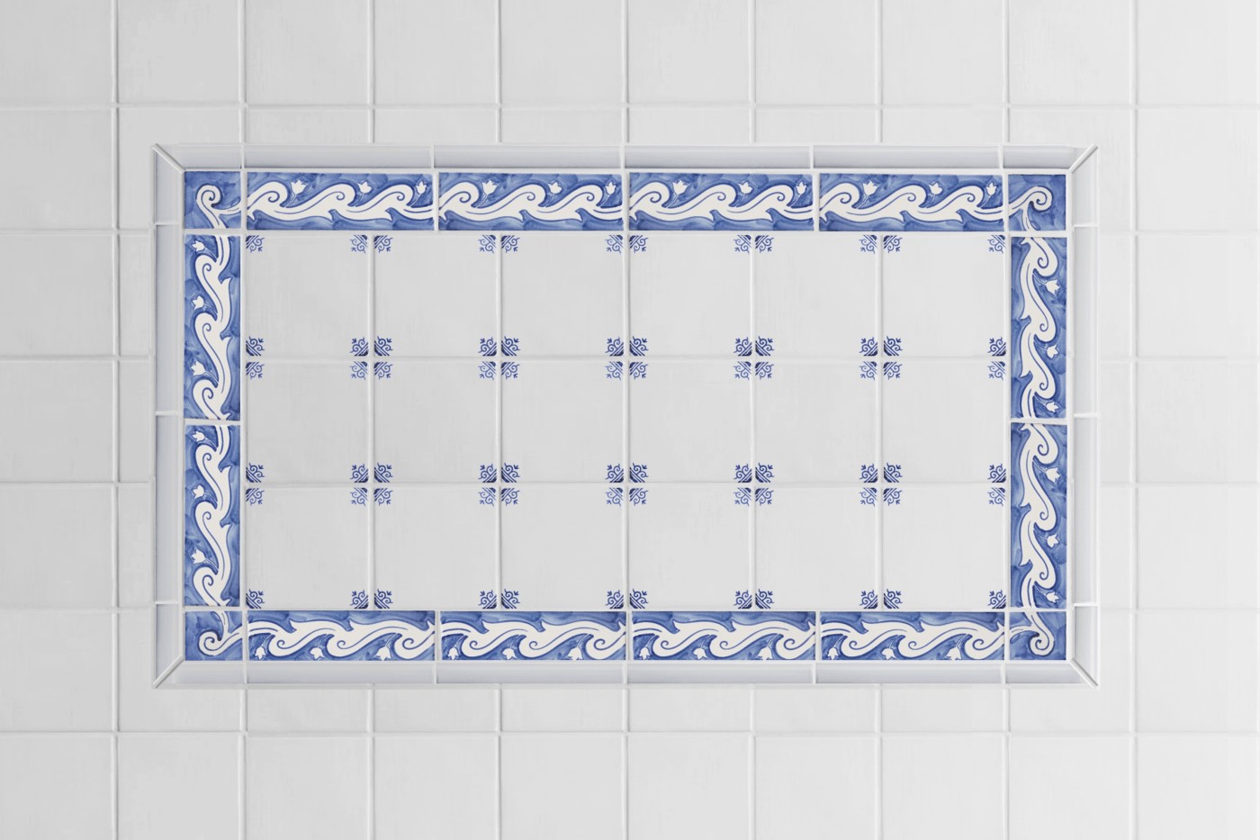 a blue and white tiled bathroom with an ornate border pattern.