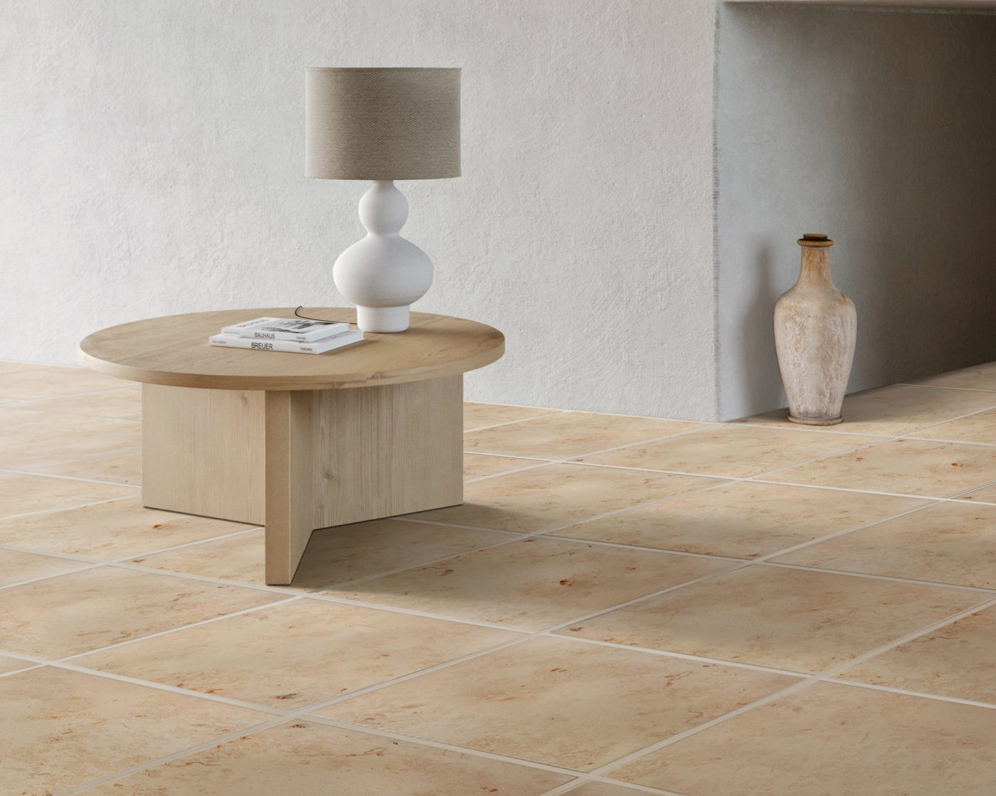 a living room with tile floors and a table.