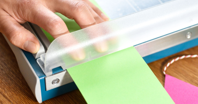 Fingers are shielded from the blade for safety.