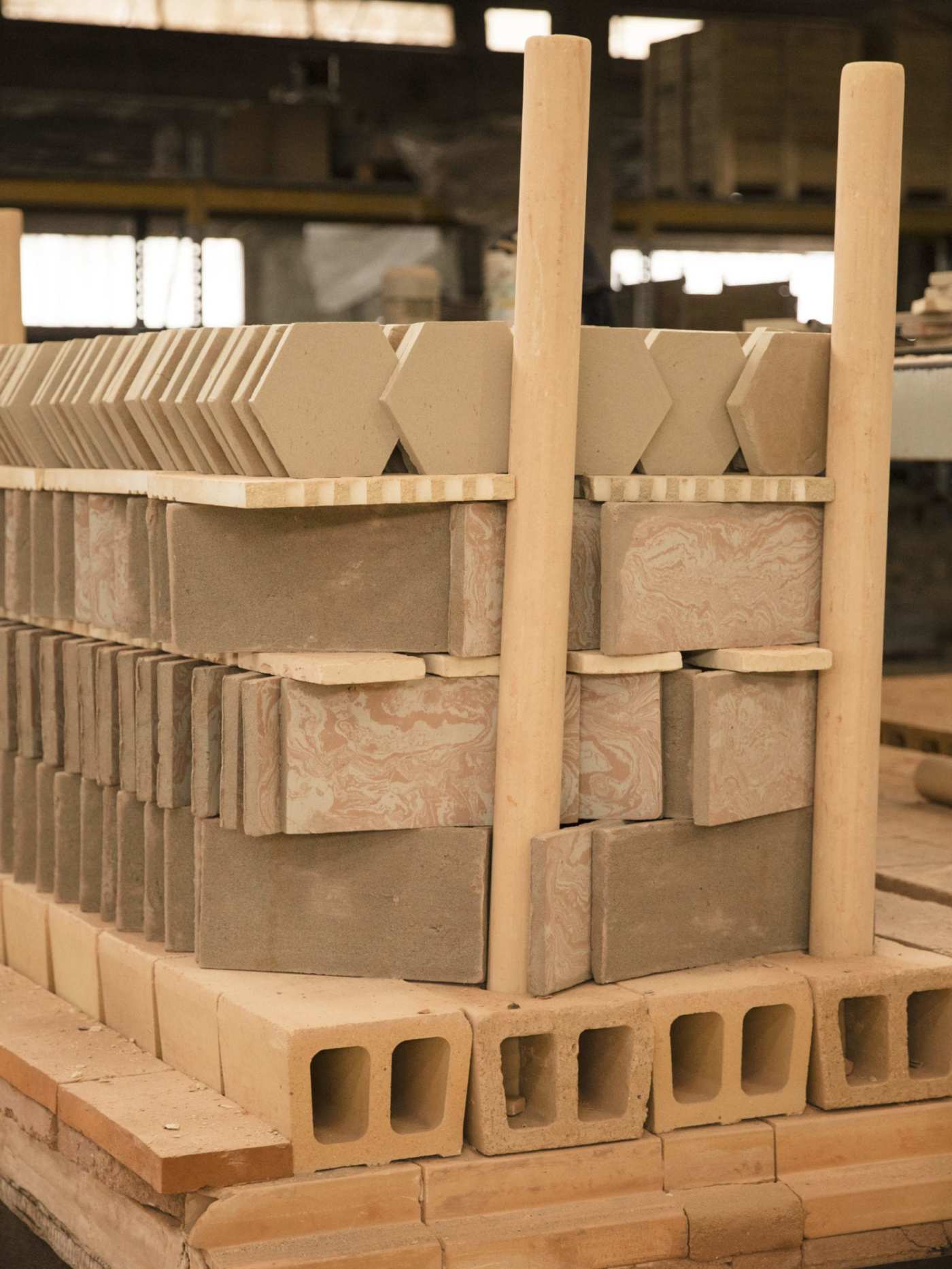 a stack of various tiles in a factory.