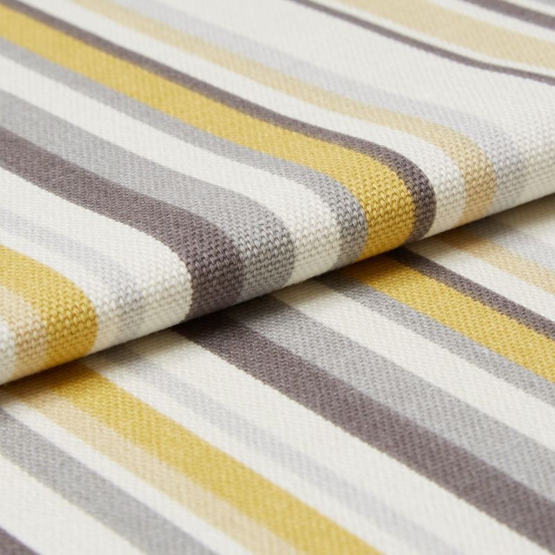 Striped woven fabric with textured knit â€” yellow, gray, beige and white bands â€” folded over itself, close-up on a flat surface under soft studio lighting.