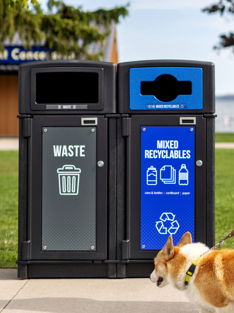 dual stream waste and recycling container made from recycled plastic outside on a city sidewalk