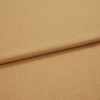 Tan woven fabric folded into two overlapping layers, showing fine textured weave and tight stitching; softly lit close-up on a neutral surface suggesting a studio or sample display.