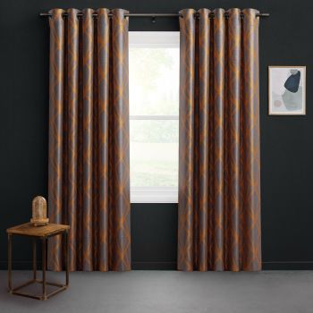 Grommet-top patterned curtains with orange-brown lattice, hung on a metal rod, partially open and filtering daylight through the window; dark-walled room with wooden side table and framed abstract art.