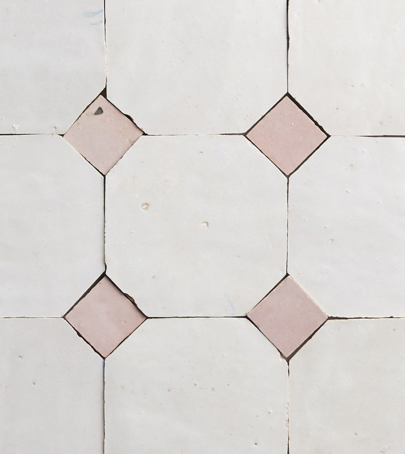 pink and whiute tiles arranged in a pattern.