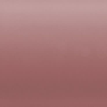 Dusty rose fabric-like panel fills the frame, showing a subtle horizontal gradient and fine texture, evenly lit against a neutral, featureless background with soft, diffuse light.