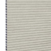 Light beige honeycomb cellular shade with pleated fabric and exposed hexagonal cell ends at left, fully lowered and closed, concealing view; close-up product-style shot on white background with even lighting.