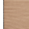 Beige honeycomb cellular blind with horizontal pleats, closed and compacted, honeycomb cells visible at the left edge; studio-lit product view against a white background.