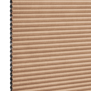 Beige honeycomb cellular blind with horizontal pleats, closed and compacted, honeycomb cells visible at the left edge; studio-lit product view against a white background.