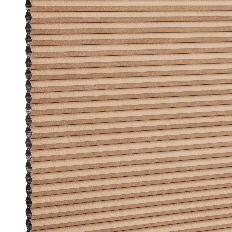 Beige honeycomb cellular blind with horizontal pleats, closed and compacted, honeycomb cells visible at the left edge; studio-lit product view against a white background.