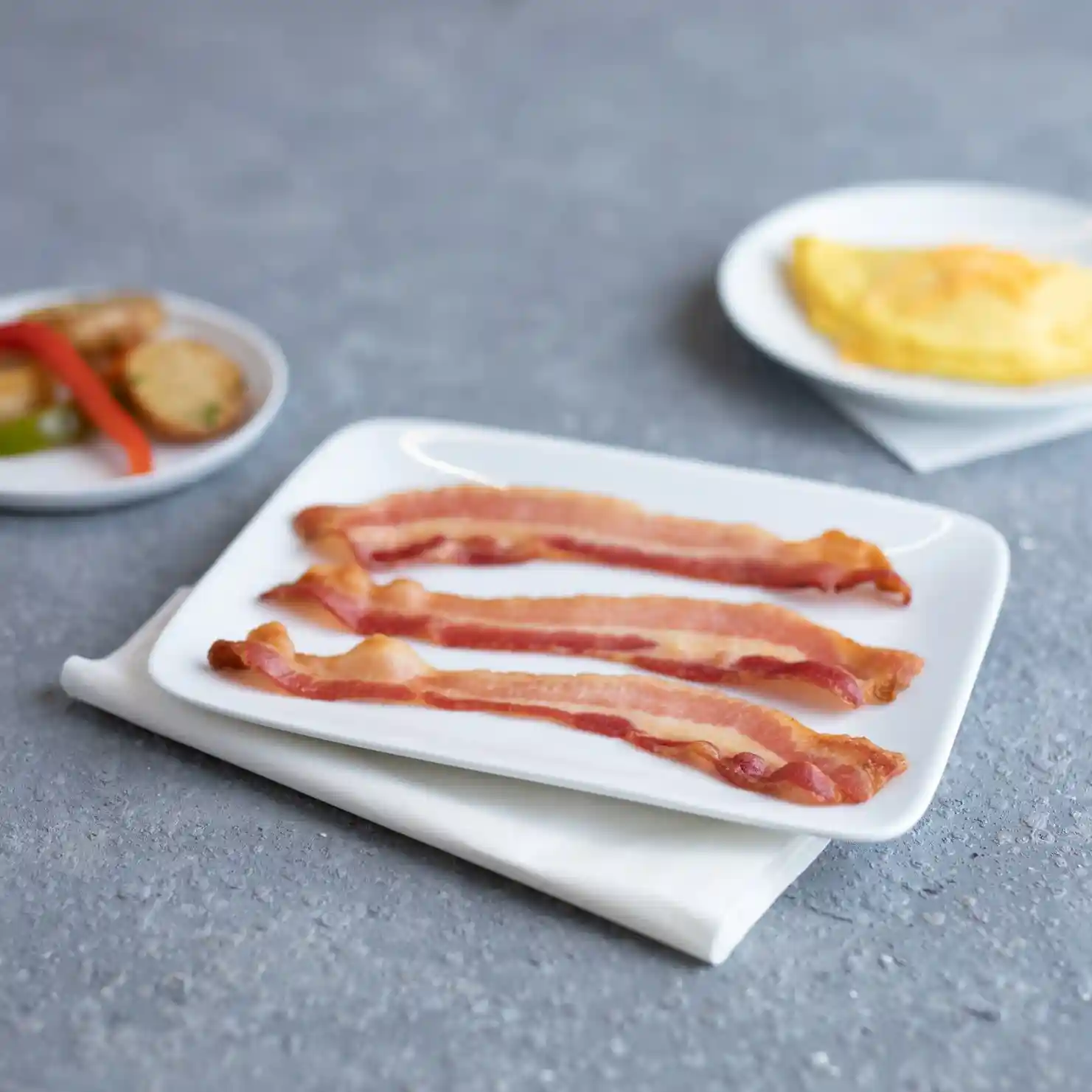 Wright® Brand Naturally Applewood Smoked Regular Sliced Bacon, Flat-Pack®, 15 Lbs, 14-18 Slices per Pound, Gas Flushed https://images.salsify.com/image/upload/s--hvqr9YxD--/q_25/nwl2fbsfoanbdbfdpndq.webp