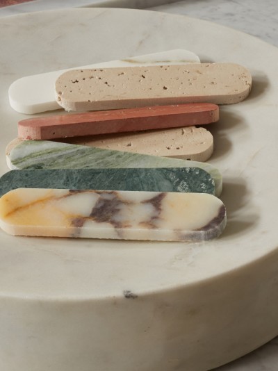 a plate with different colored marble sticks on it.