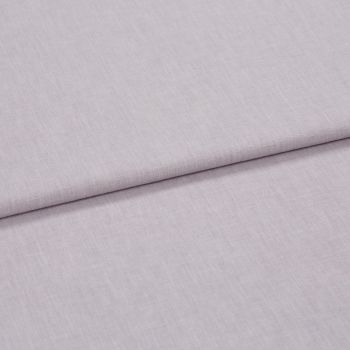 A folded pale lavender woven fabric, folded once to create a horizontal overlap, close-up on a flat surface with soft, diffuse lighting highlighting the subtle weave texture.