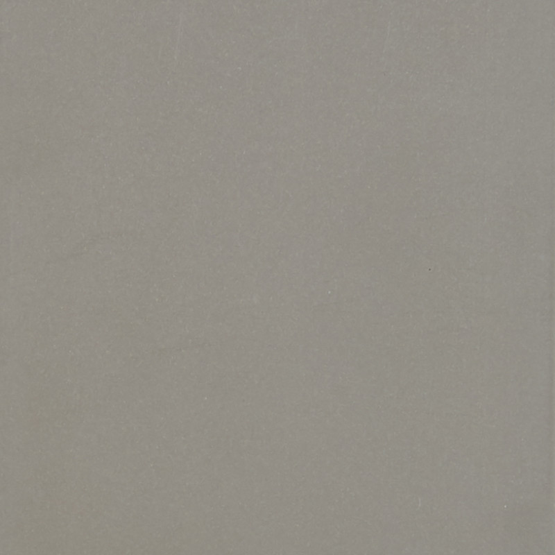 Light-gray textured sheet or wall sits flat and unadorned, filling the frame under even diffuse lighting, with subtle speckling and a faint vertical edge visible.