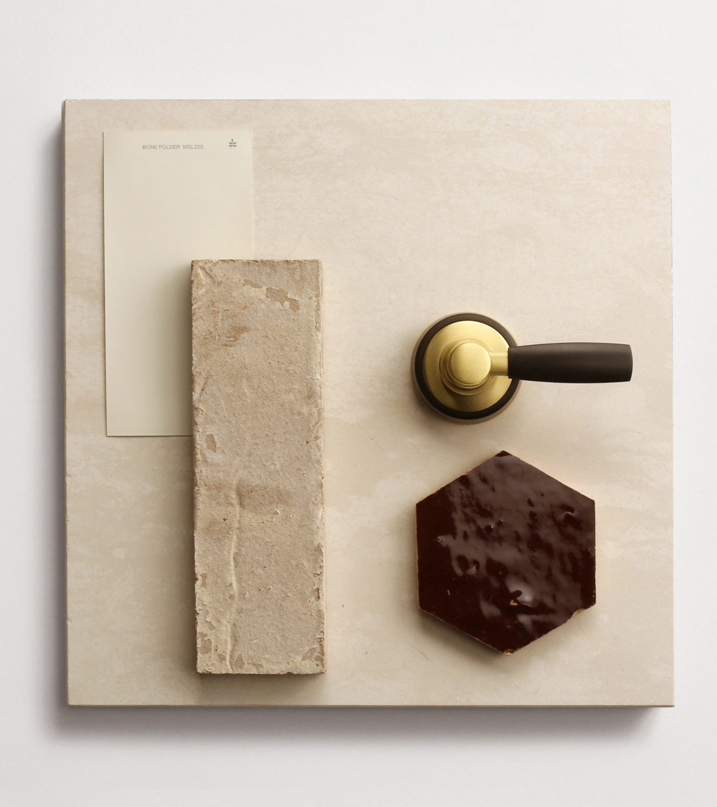 a tray with chocolate, a knife, and a pencil.